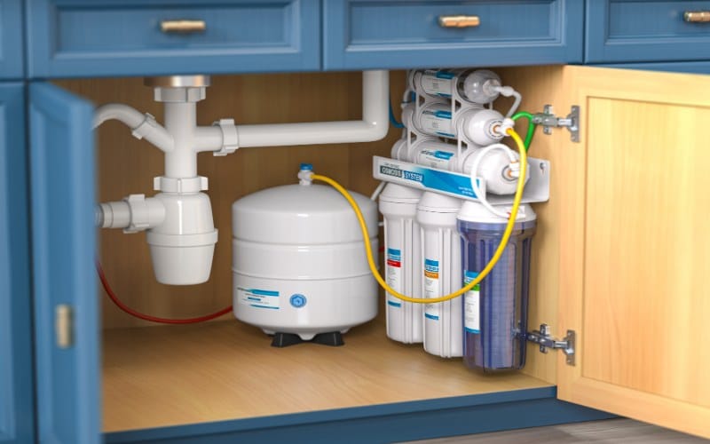 Family in Edmond, OK enjoying crystal clear water from their kitchen tap, thanks to their new water filtration system by Anderson Plumbing Heat and Air