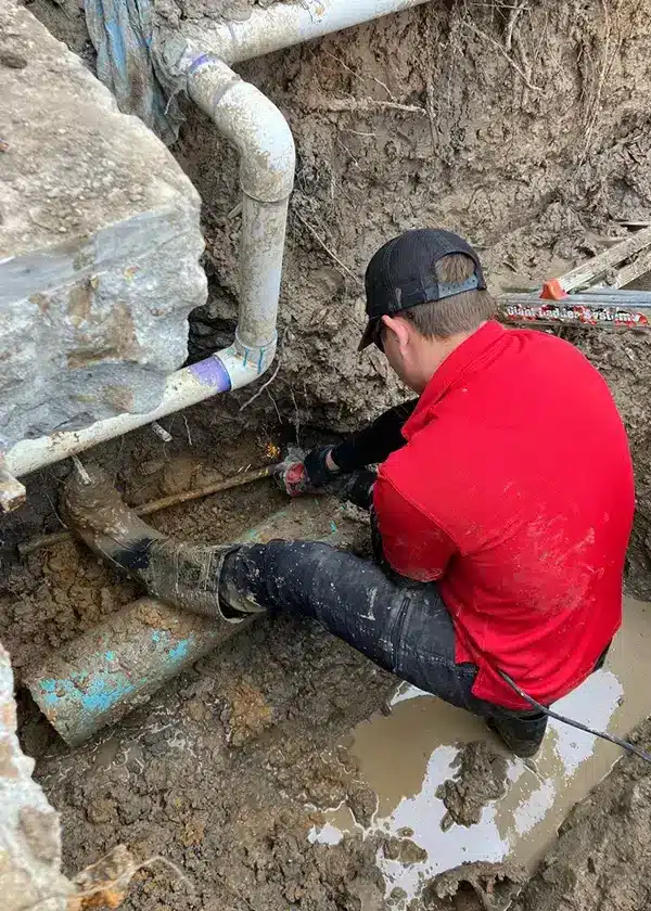 Plumber performing routine inspection at a Piedmont, OK medical office to ensure safe commercial water systems