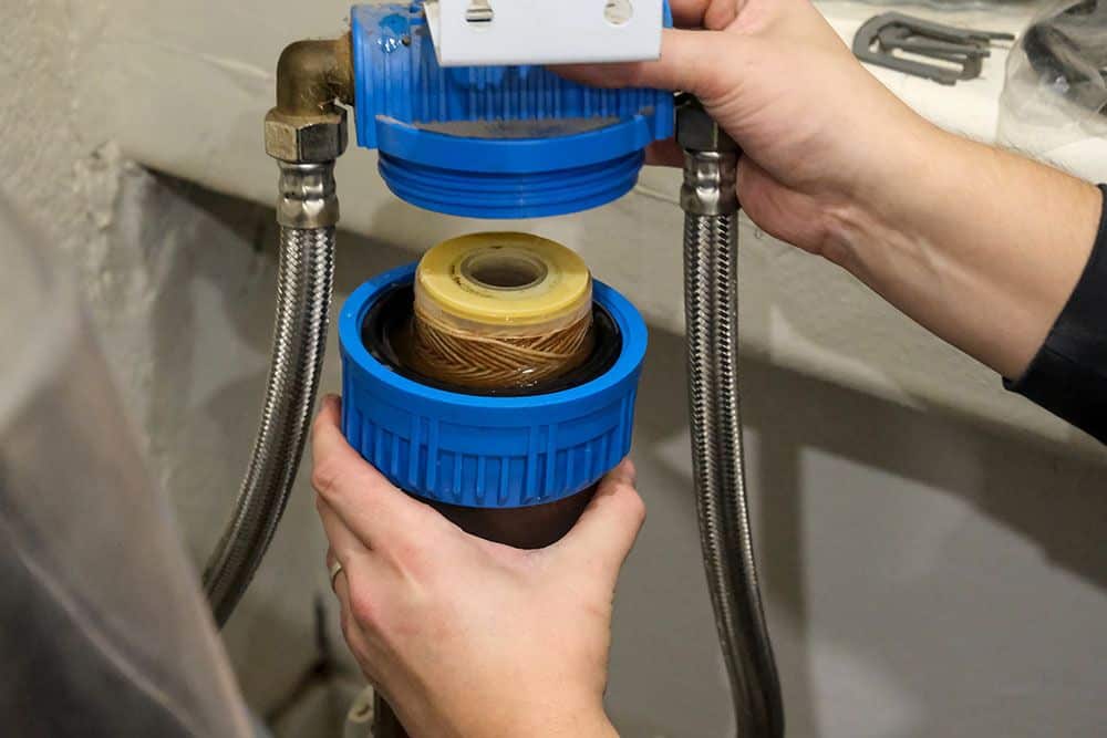 Experienced plumber using inspection camera to detect hidden issues in Edmond, OK commercial building