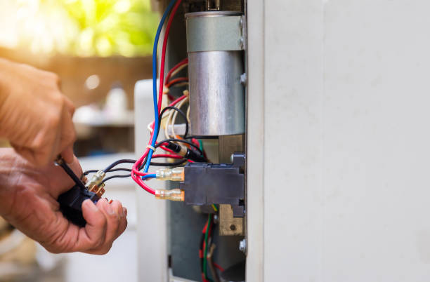 Specialist completing Furnace Repair on an indoor unit in a Nichols Hills, OK residence